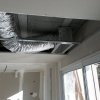 Installation d'un système de climatisation réversible à Peypin : Solution gainable avec gaine et grille de soufflage en faux plafond 